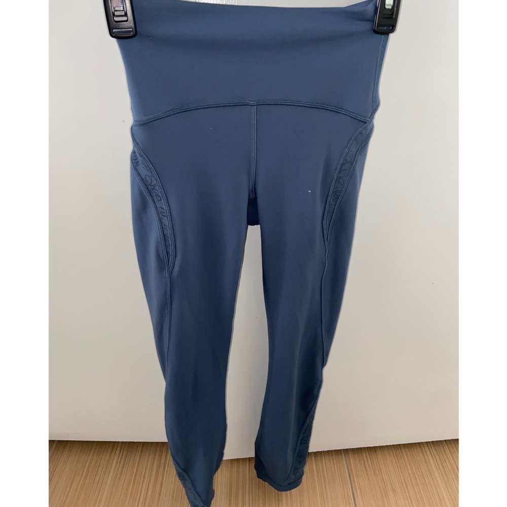 Blueish-grey lululemon leggings with floral mesh pattern